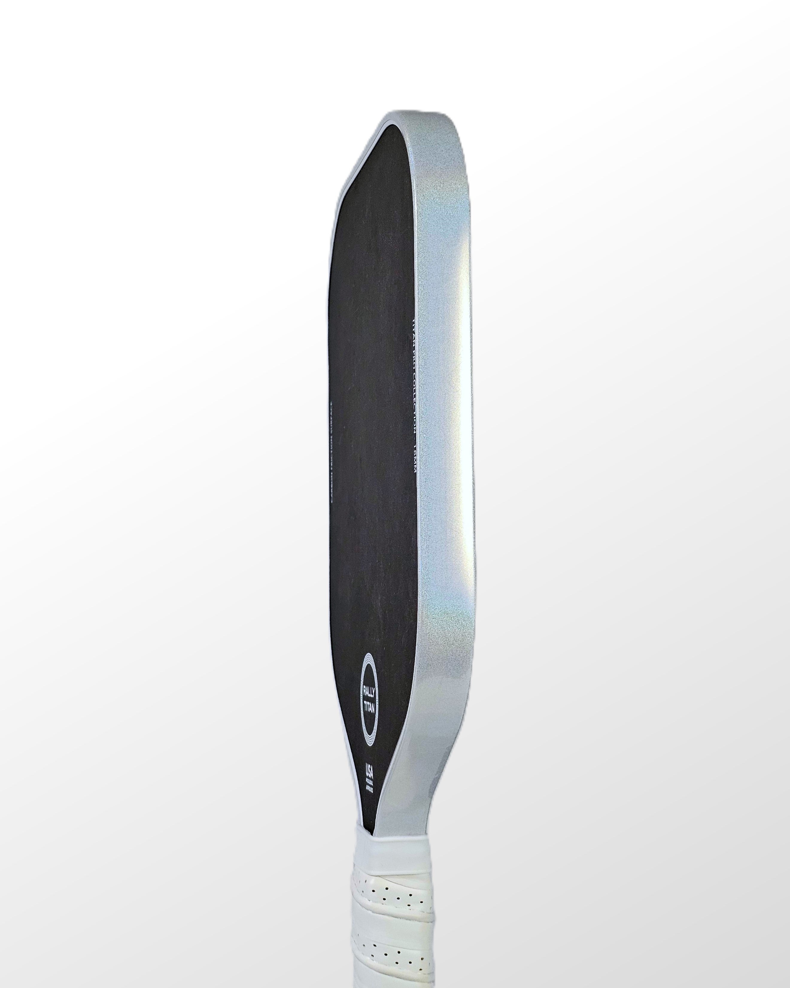 Pickleball paddle with white prism edge tape