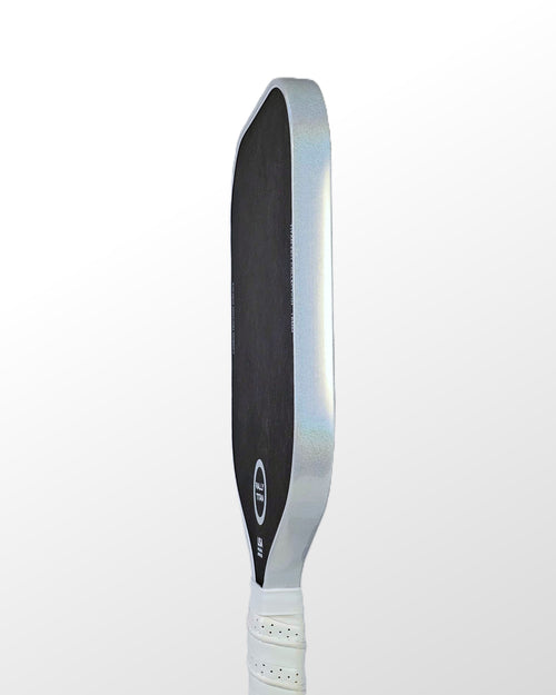 Pickleball paddle with white prism edge tape