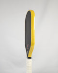 Pickleball paddle with yellow metallic edge tape