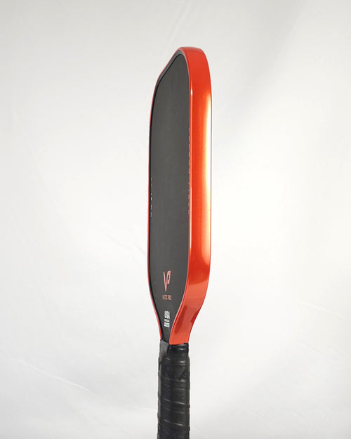Vatic Pro pickleball paddle with orange metallic edge tape