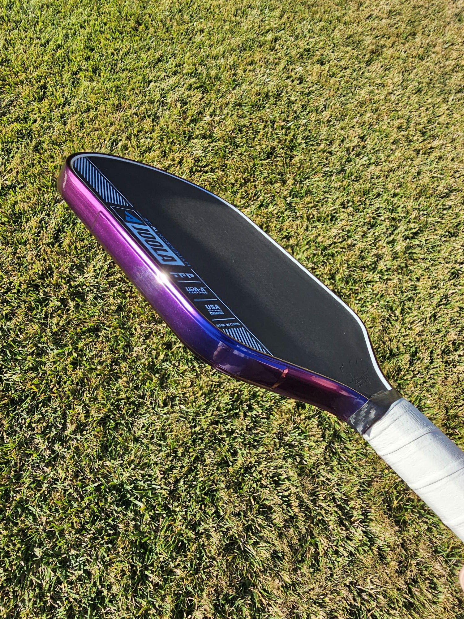 Joola Hyperion pickleball paddle with Blue/Purple color shift edge tape showing both blue and purple colors