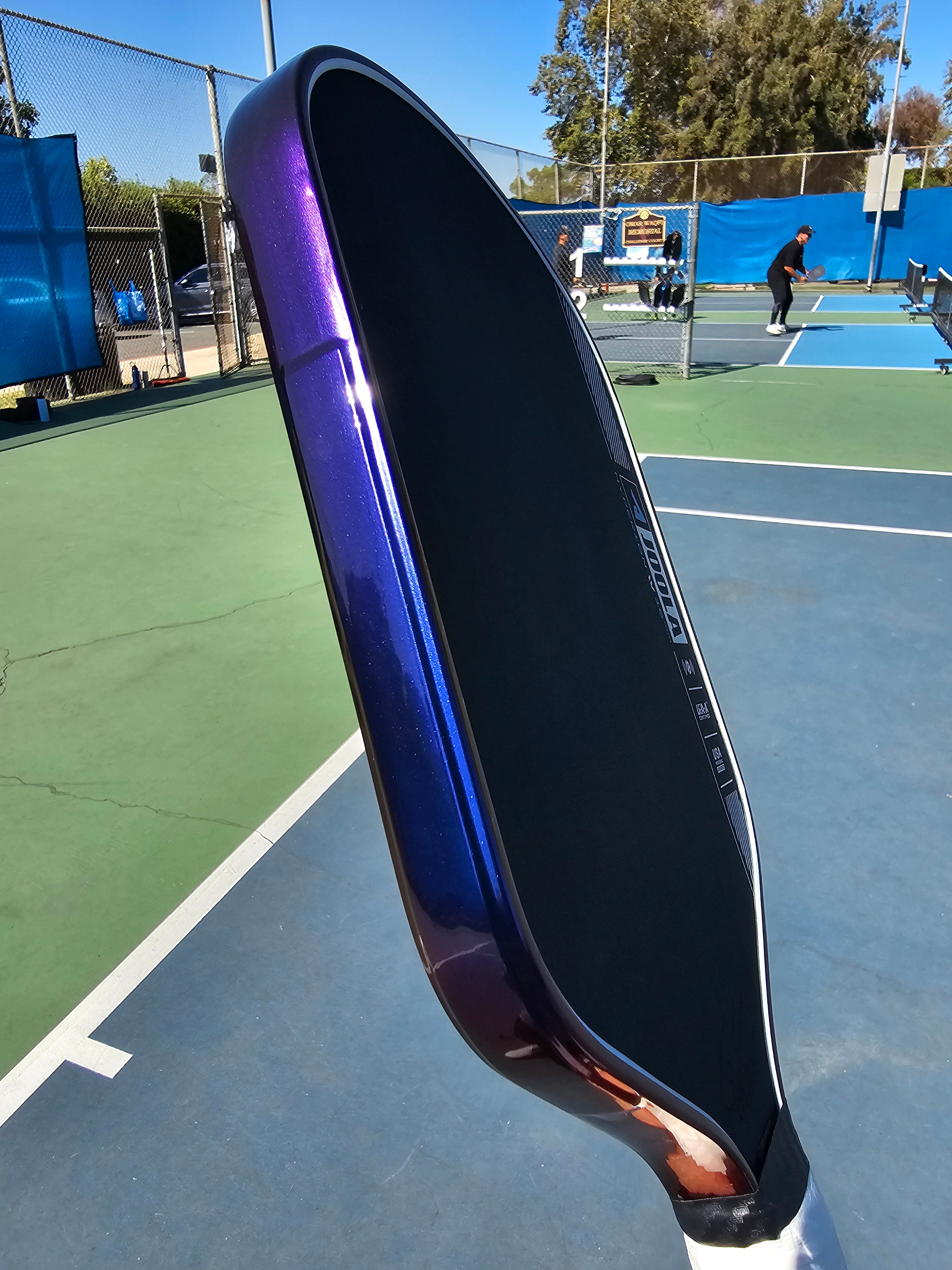 Close-up of a Joola Hyperion pickleball paddle with Blue/Purple color shift edge tape