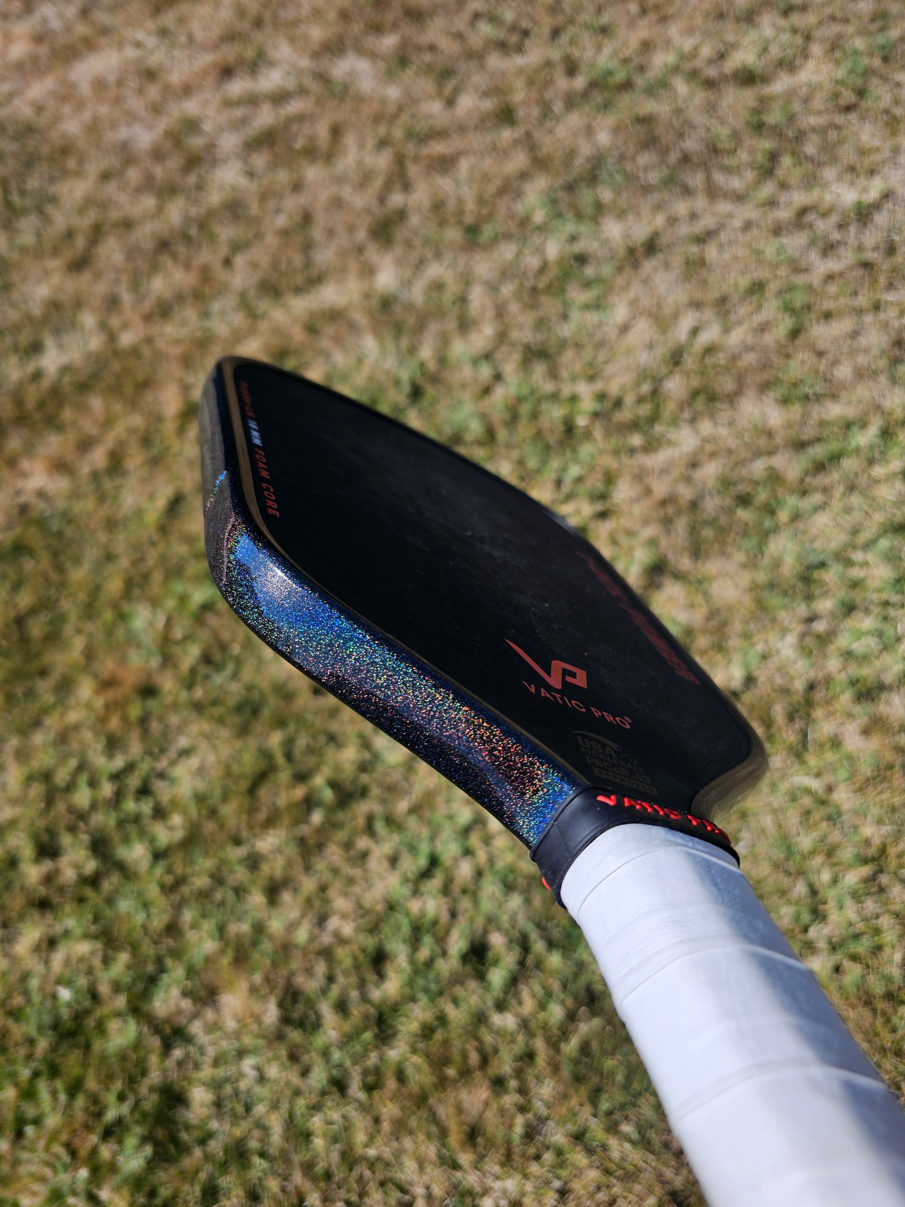 Vatic Pro V-Sol Power pickleball paddle with Black Prism edge tape showing prismatic effect