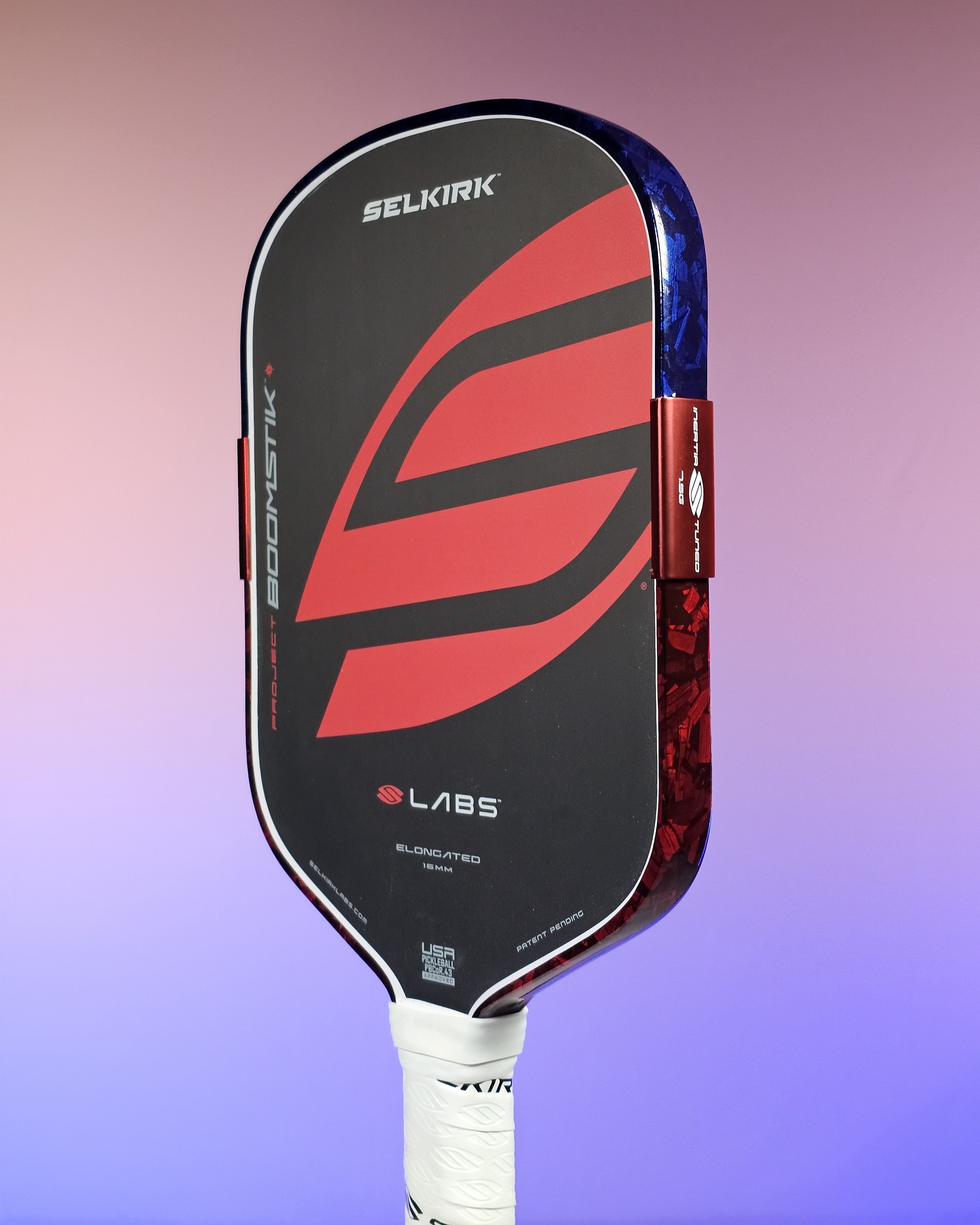 Selkirk Boomstik pickleball paddle with 2-tone Blue Forged Carbon and Red Forged Carbon edge tape.