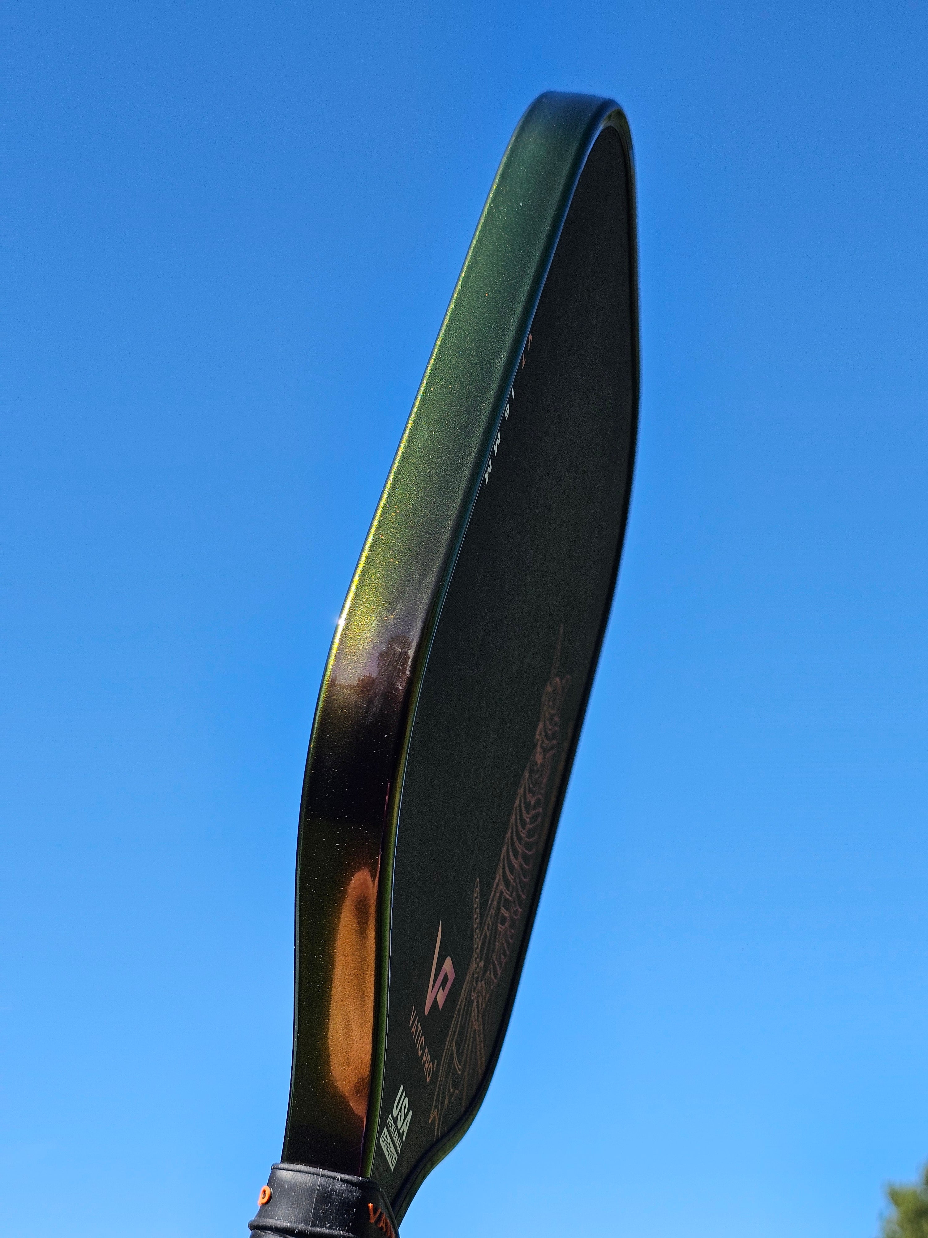 Vatis Pro pickleball paddle with Indigo Sunset color shift edge tape shifting to a shade of green