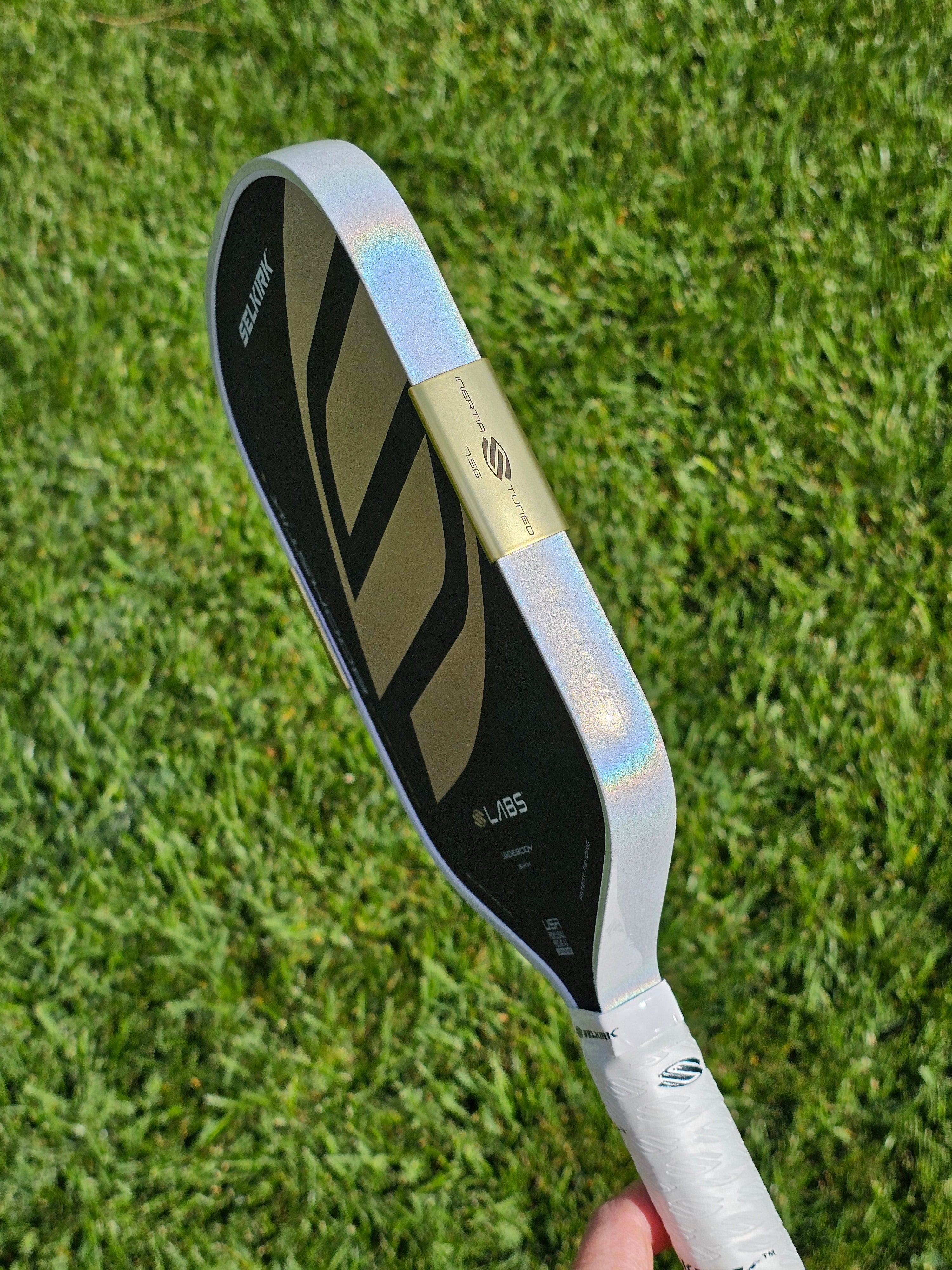 Regal Selkirk Boomstik pickleball paddle with White Prism edge tape showing the prism effect
