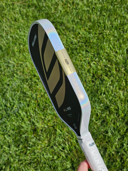Regal Selkirk Boomstik pickleball paddle with White Prism edge tape showing the prism effect