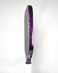 Pickleball paddle with purple forged carbon edge tape