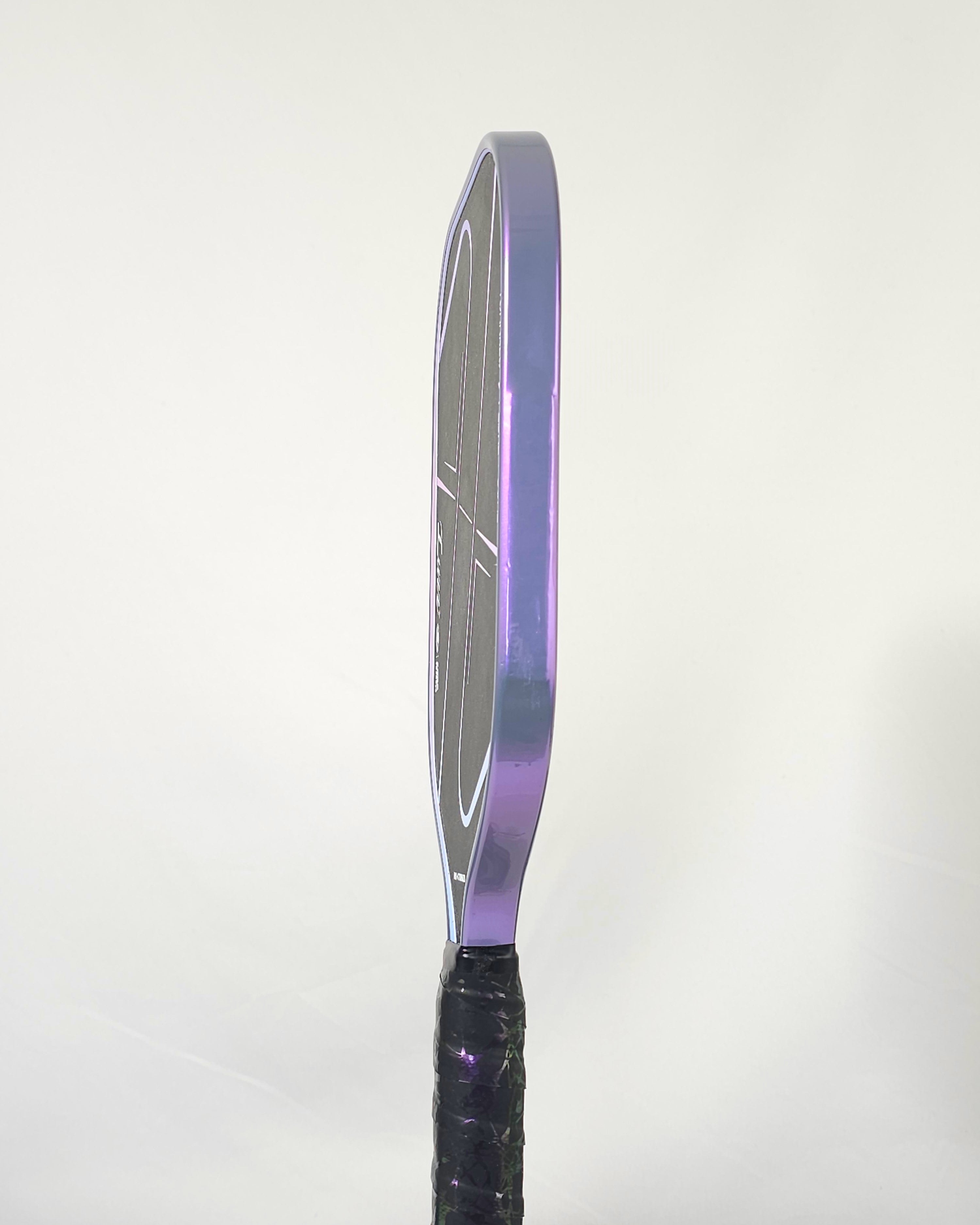 Luzz Tornazo pickleball paddle with grey/purple edge tape