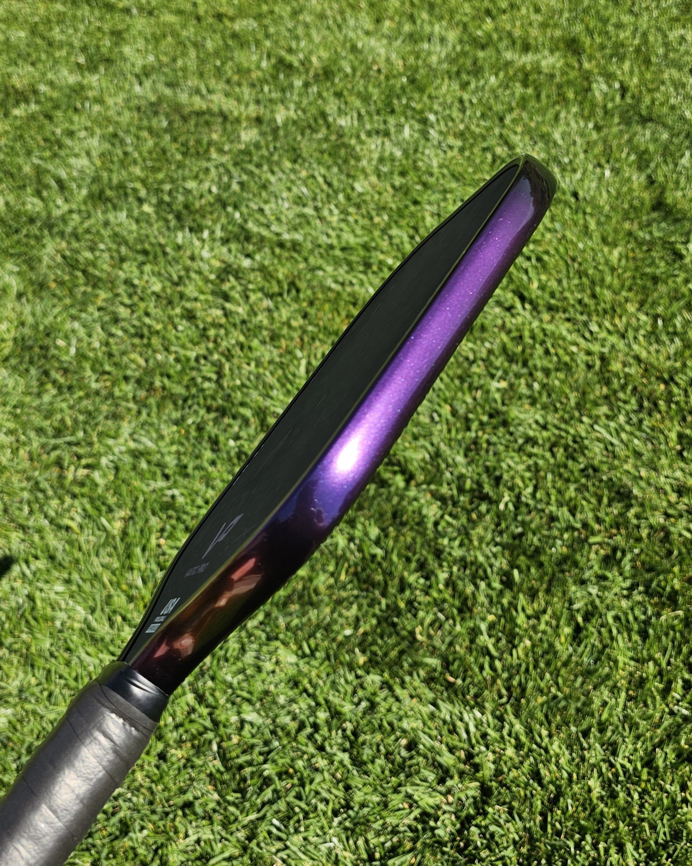Vatic Pro pickleball paddle with Indigo Sunset color shift edge tape shifted to a deep shade of purple