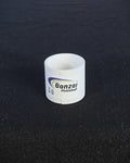 A clear roll of Banzai Pickleball edge tape shown on a black textured background.