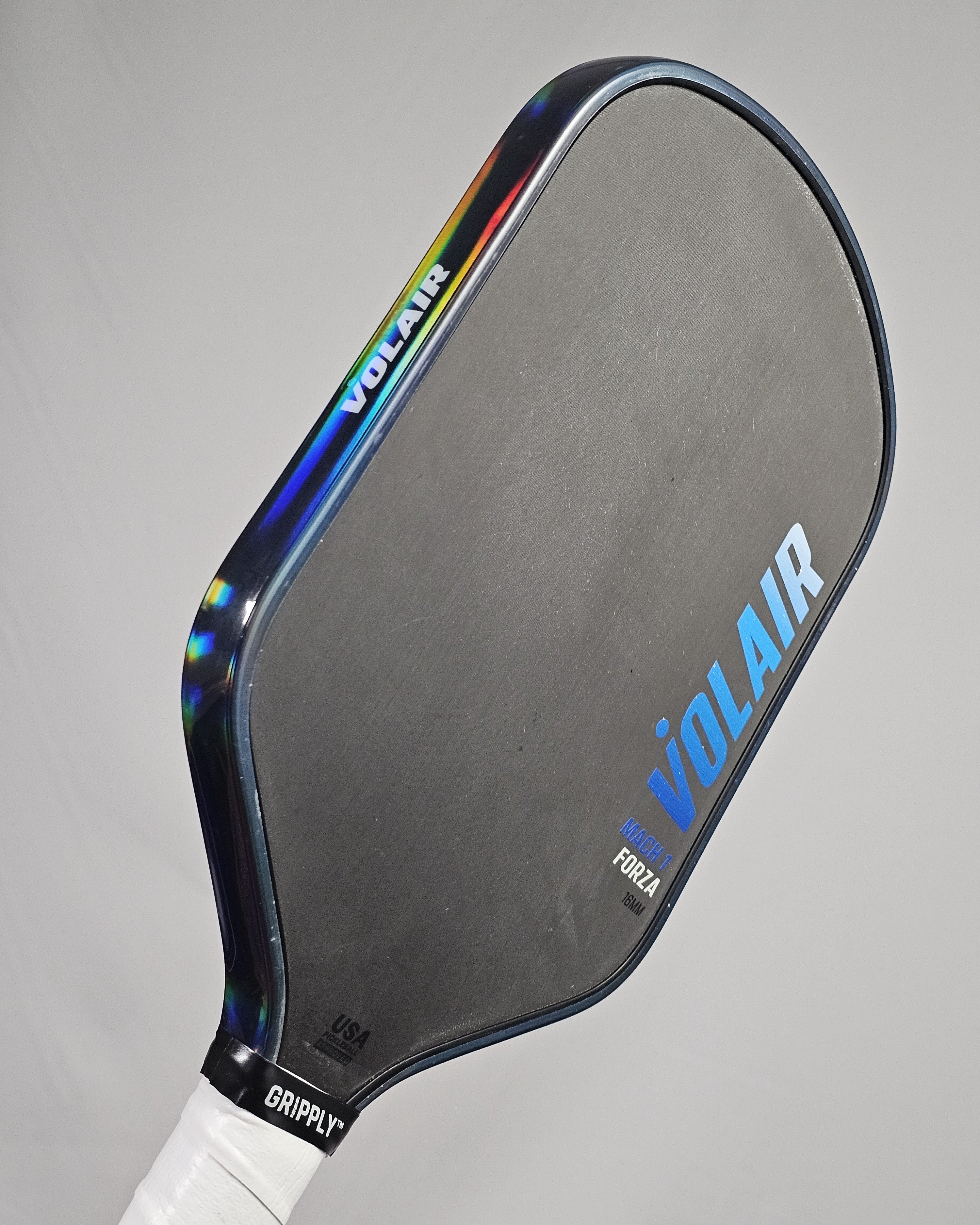 Pickleball paddle with clear hologram edge tape showing holographic rainbow effect