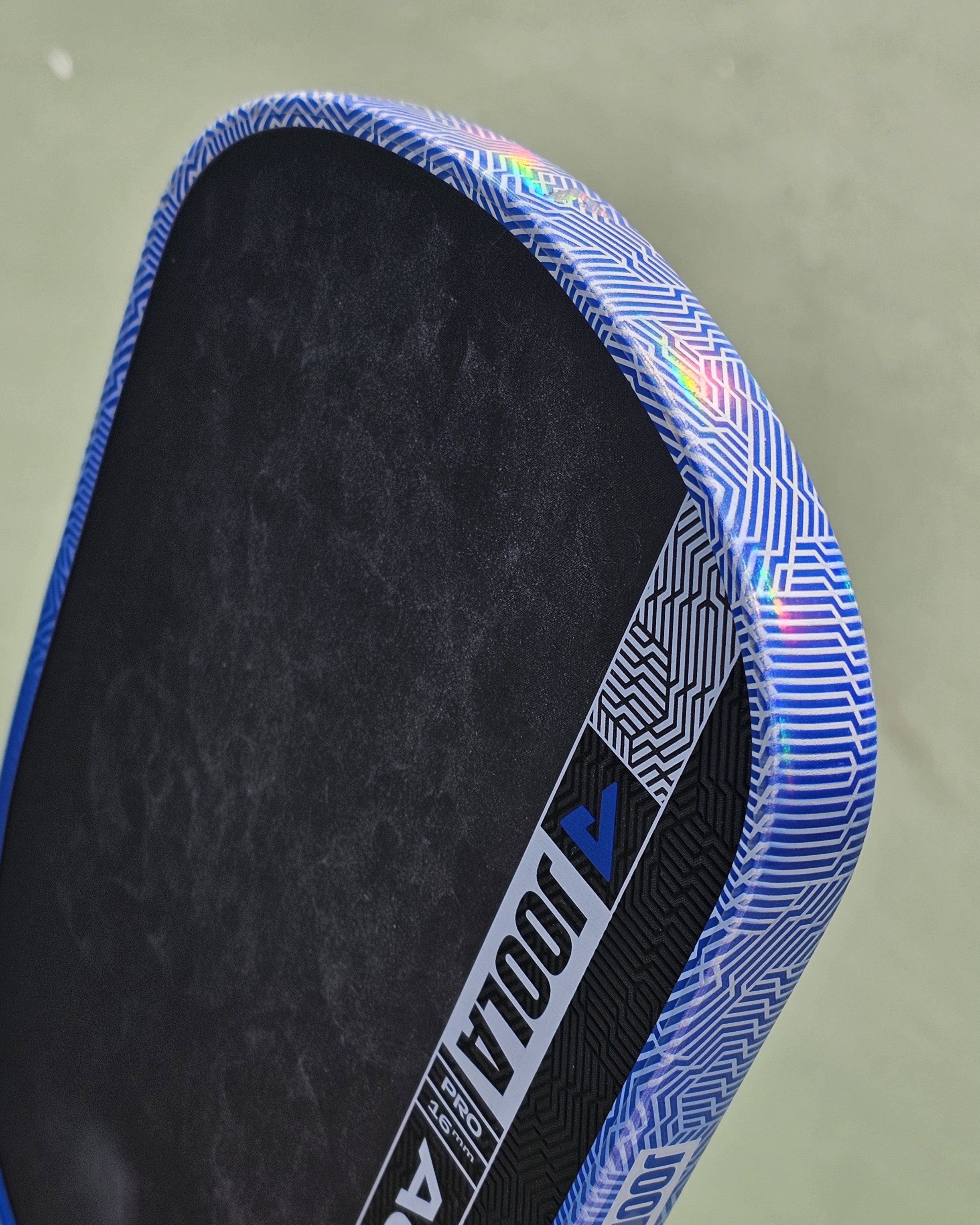 Close up of paddle with clear hologram edge tape