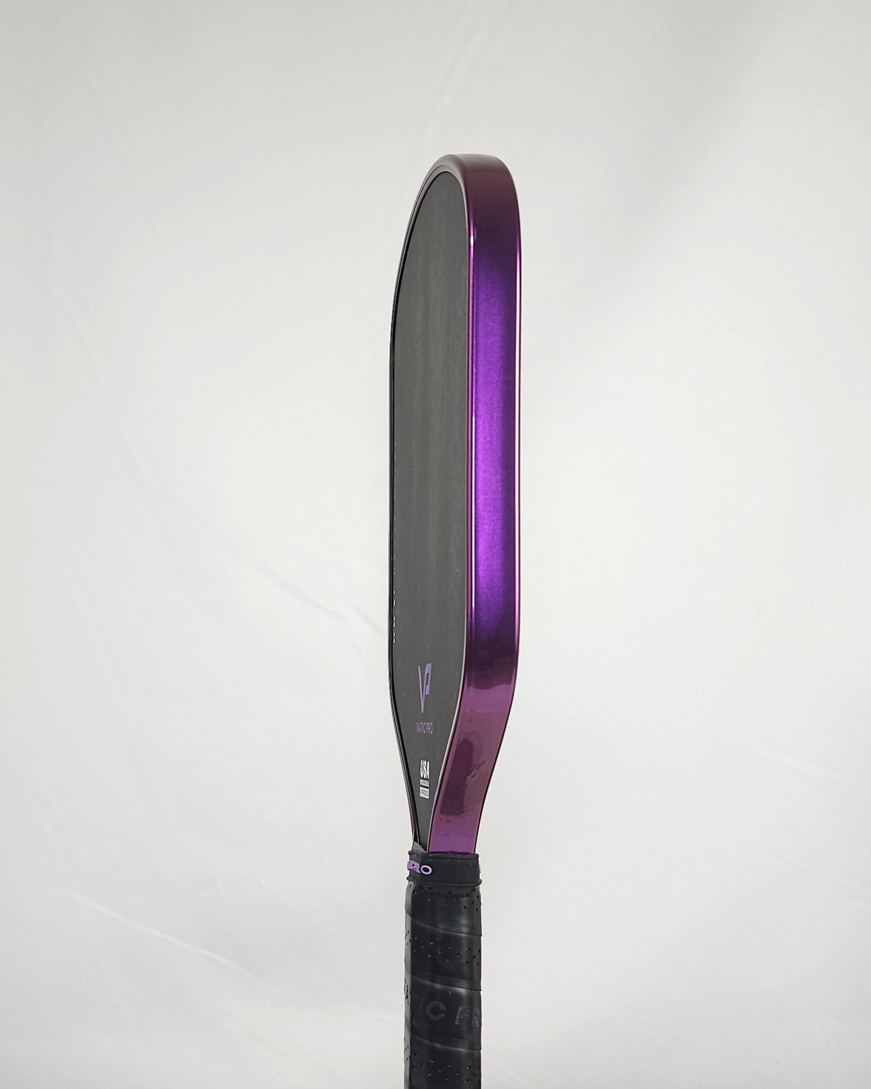 Pickleball paddle with purple metallic edge tape