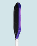 Studio image of an RPM Q2 picklleball paddle with purple edge tape installed.
