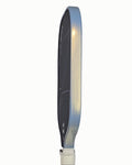 Close up edge view of a pickleball paddle showing the installed platinum and gold protective edge guard tape