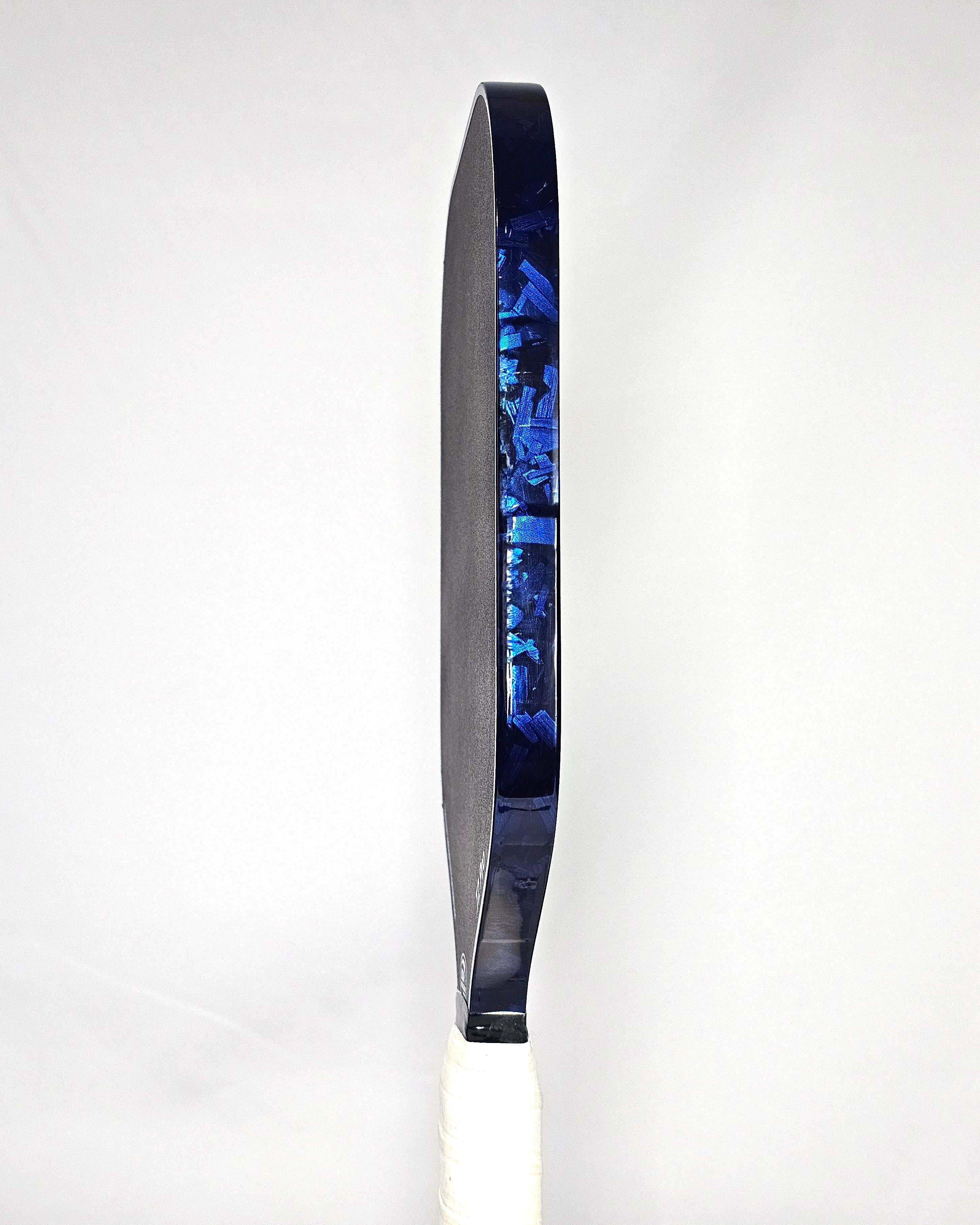 Edgeless pickleball paddle with blue forged carbon edge tape