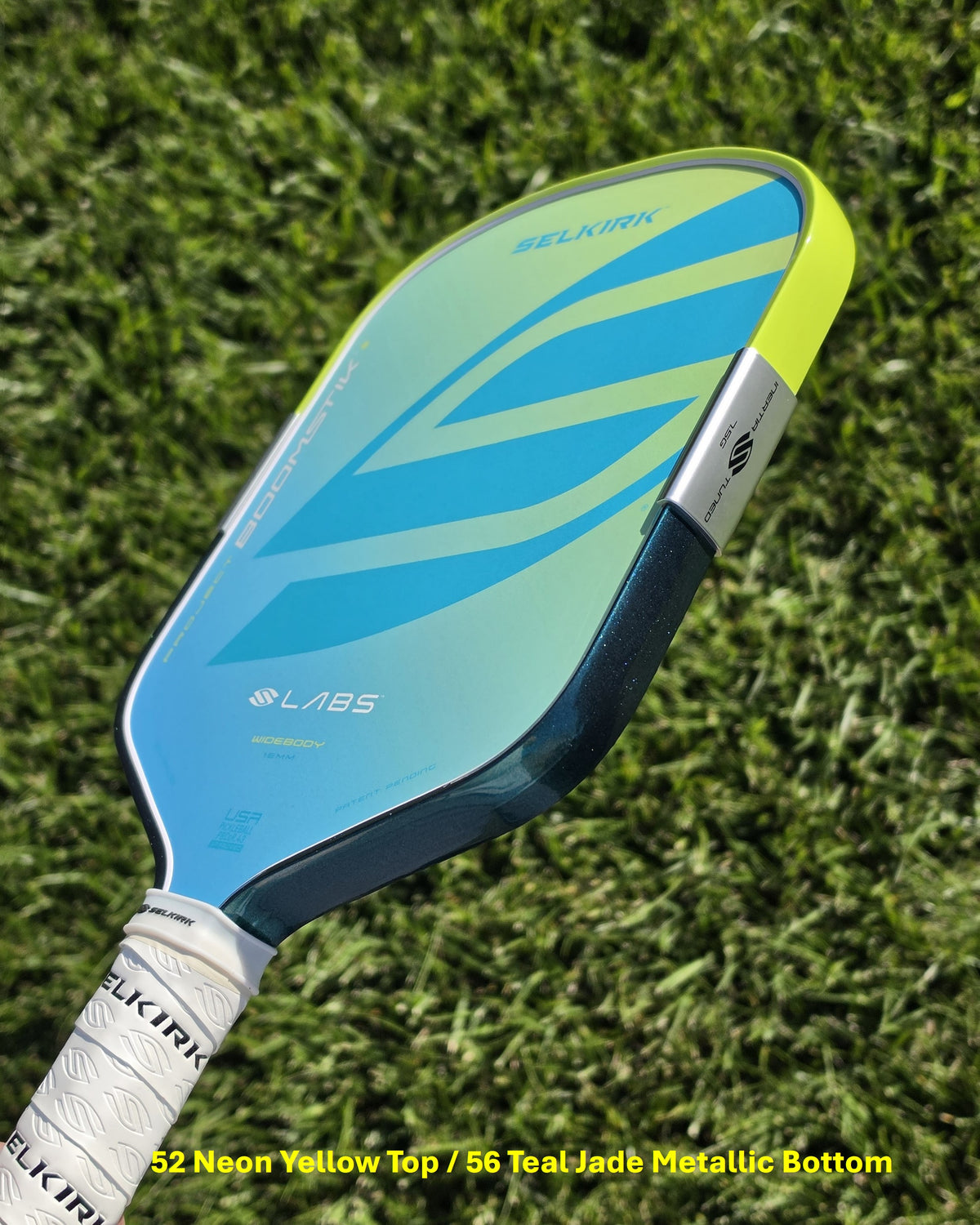 Selkirk Boomstik pickleball paddle with neon yellow and teal jade metallic edge tape