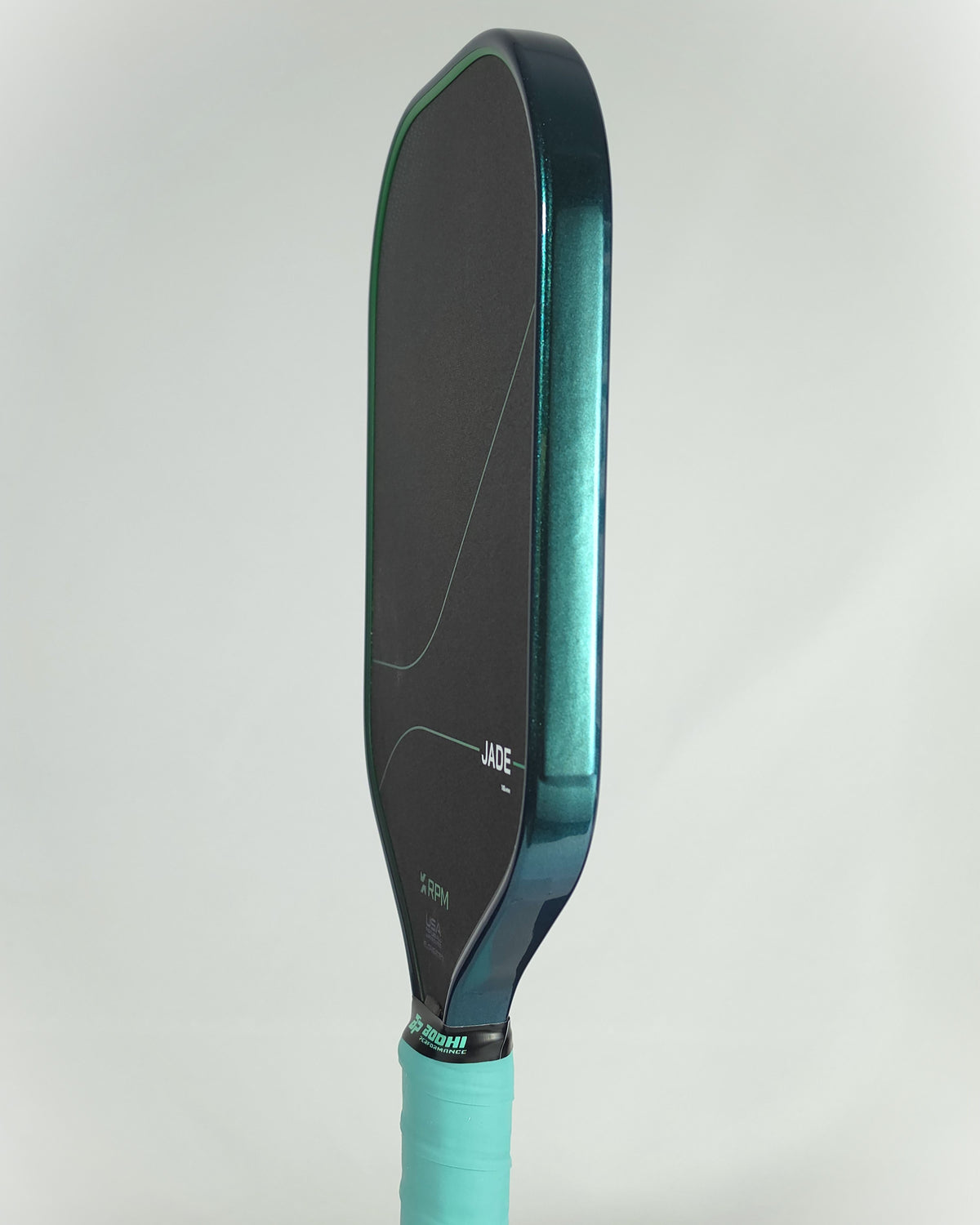 RPM Jade pickleball paddle showing a teal jade metallic edge tape