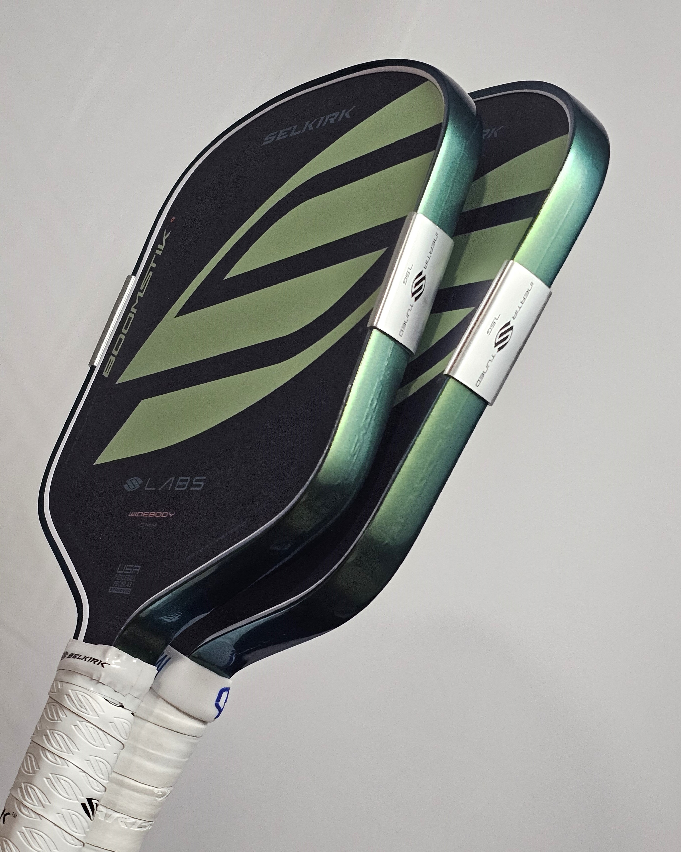 2 Selkirk Boomstik paddles with green color shift edge tape installed