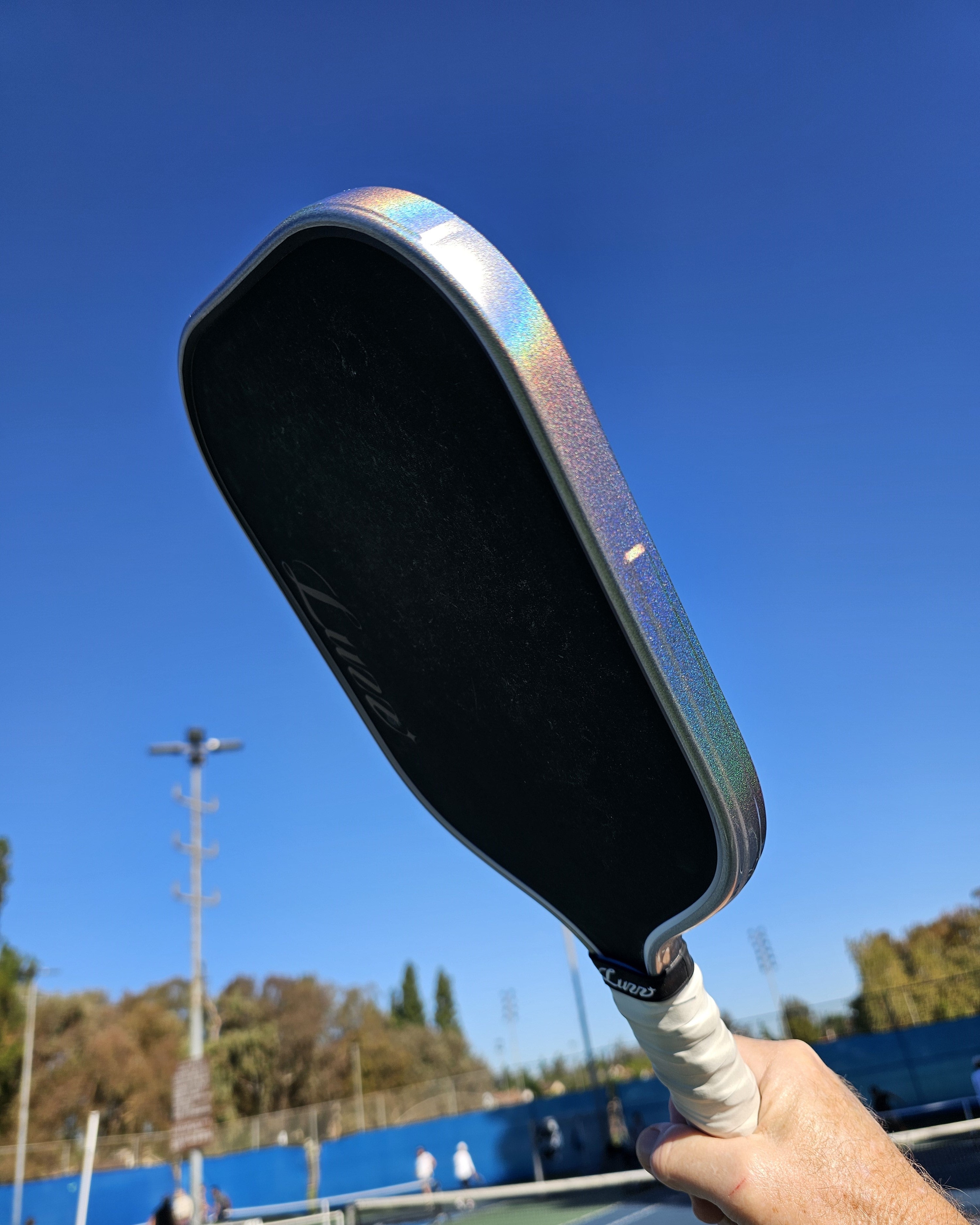 Luzz pickleball paddle with Silver Prism edge tape