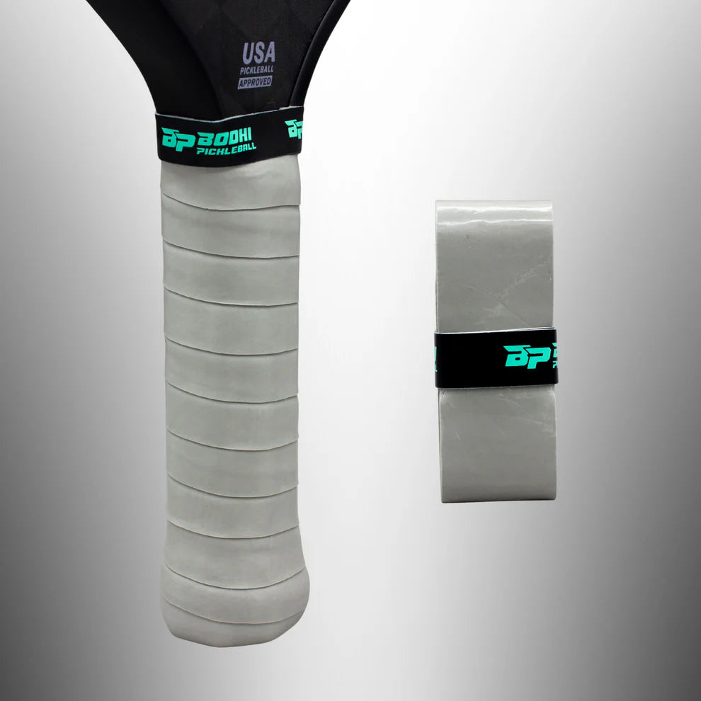 Grey BODHI Pickleball overgrip against a grey backgrount