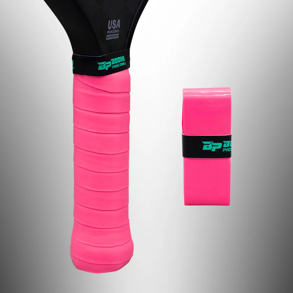 Pink BODHI Pickleball overgrip on a gray background