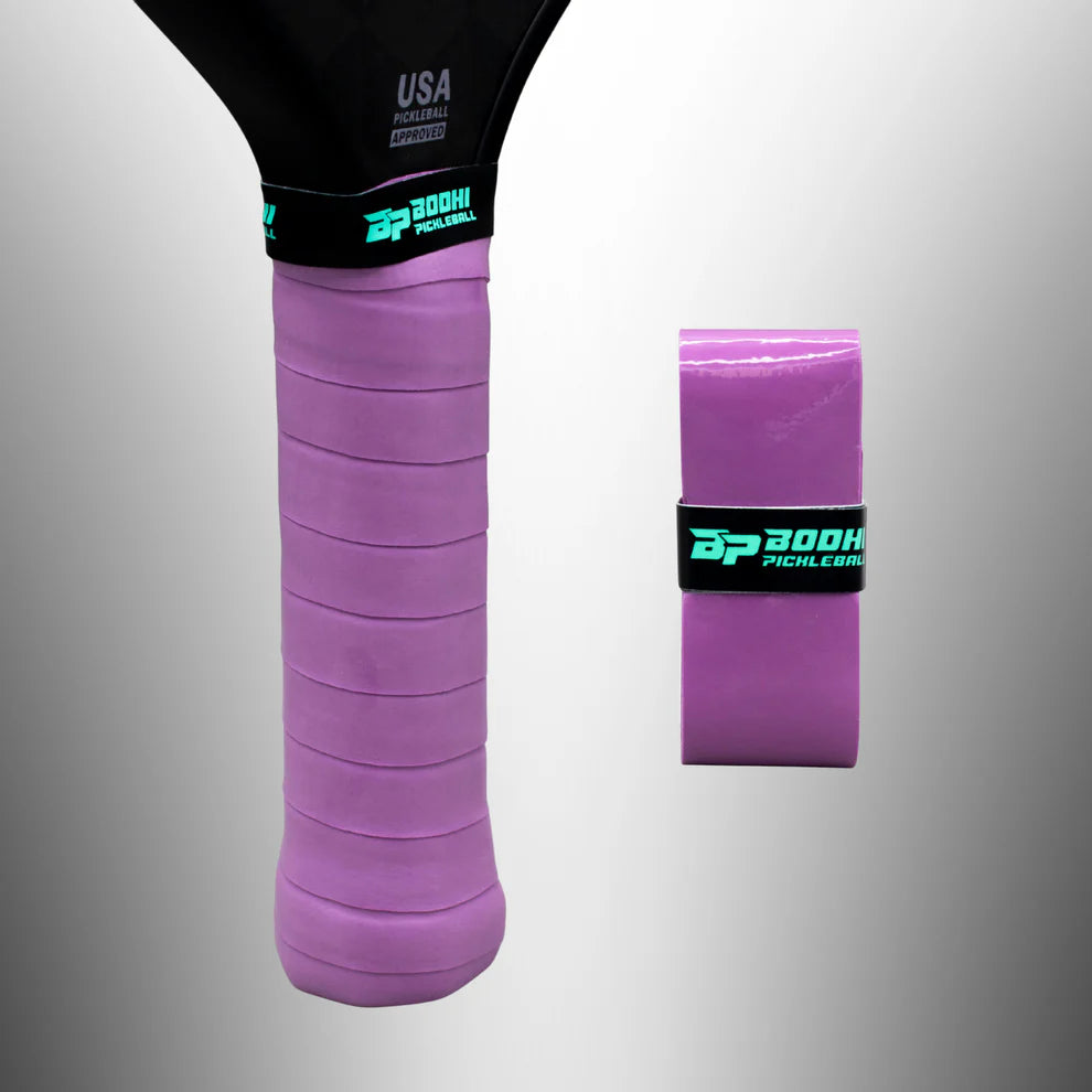 Purple BODHI pickleball overgrip on a gray background