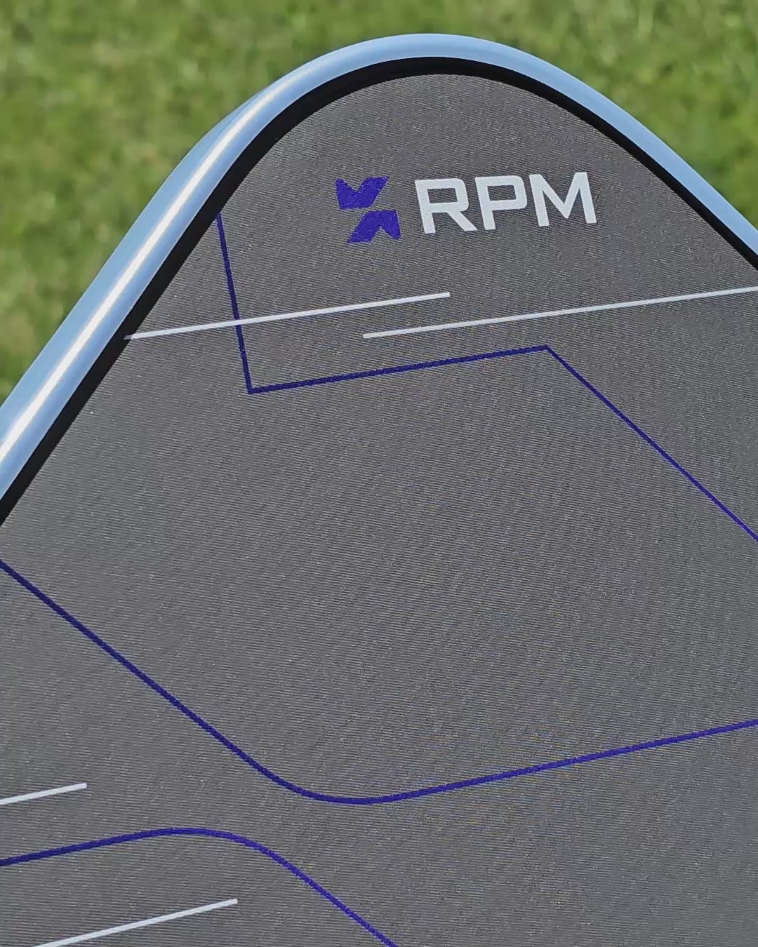 Video of a RPM pickleball paddle showing a platinum and gold edge guard protective tape