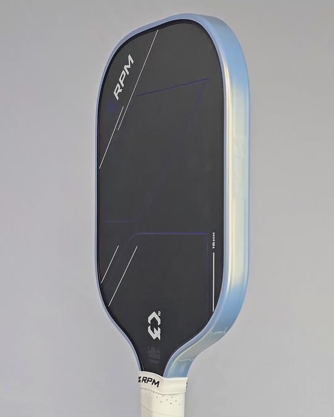 Video clip of a rotating pickleball paddle showing the installed platinum and gold protective edge guard tape